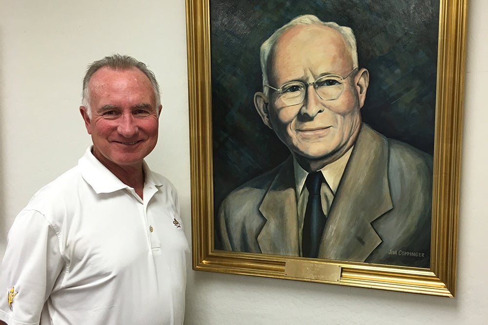 Art Pearce with a portrait of Zebulon Pearce